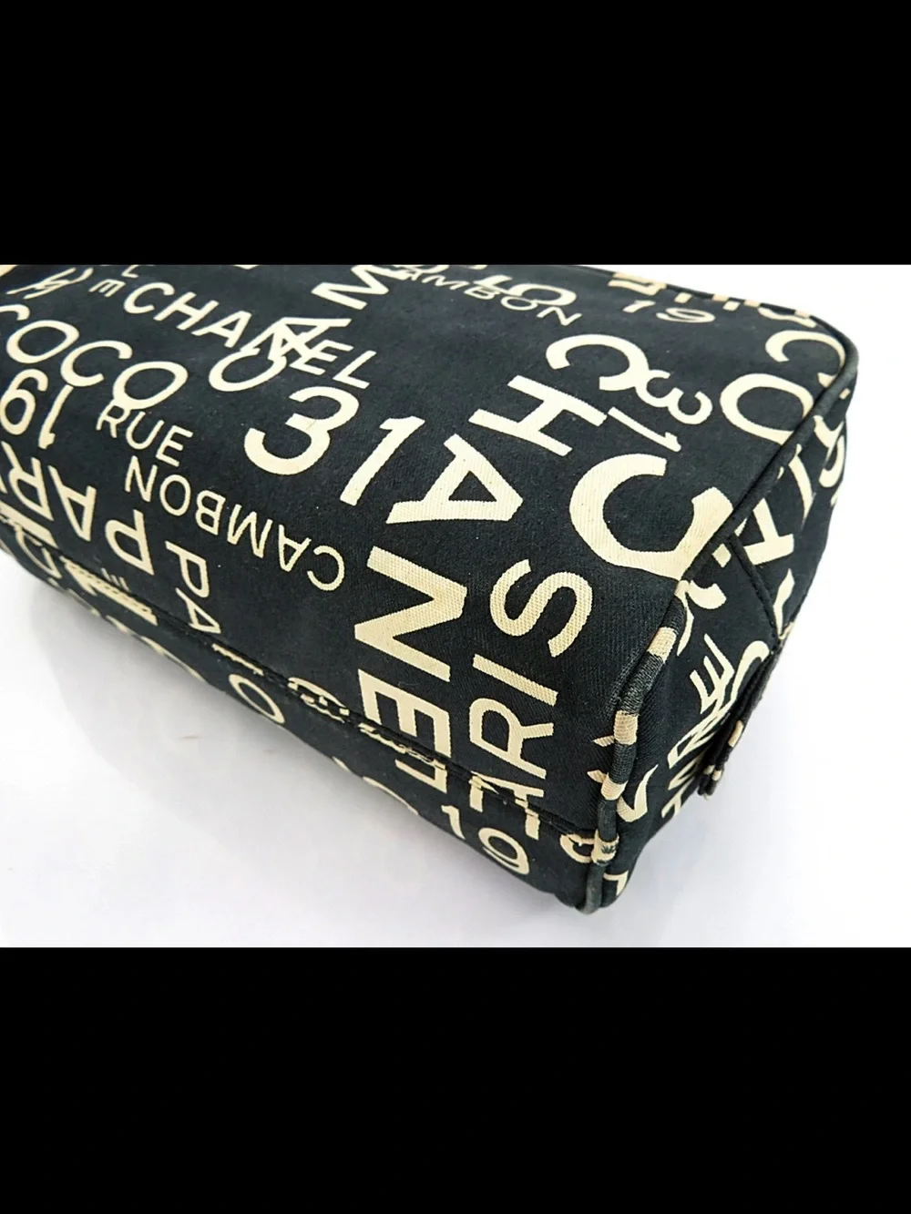 CHANEL Black Canvas Logo Print Cosmetic Pouch with Cream Lettering